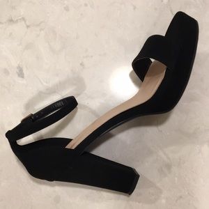 Black heels, buckle at ankle